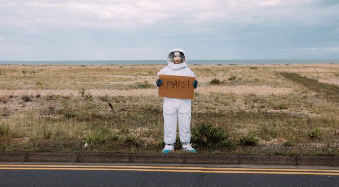 person in a costume hitchhiking